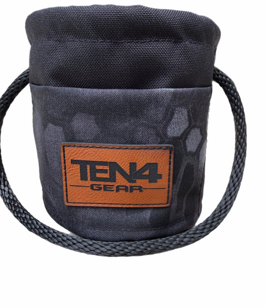 Typhon Grunt Sack, dark camo bag with rope handle and brown logo patch