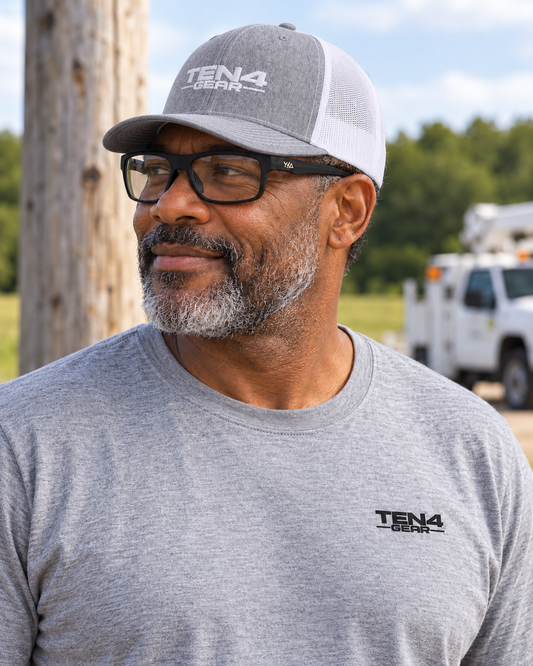 Model wearing the TEN4 Signature Tee in Sport Grey with black left chest logo, Heather/White TEN4 Full Logo hat and Wye Delta FullViz Clear glasses.