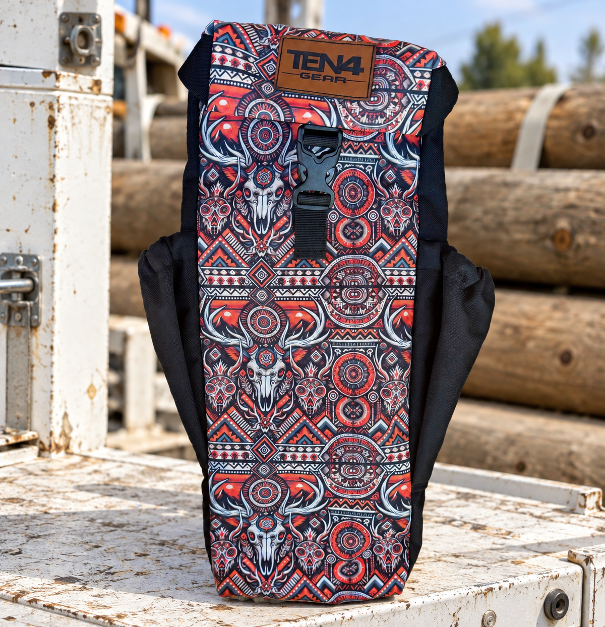 Cowboy Utility bag with formed buckle lid and two black side pockets — original product photo; background edited to an outdoor utility jobsite.