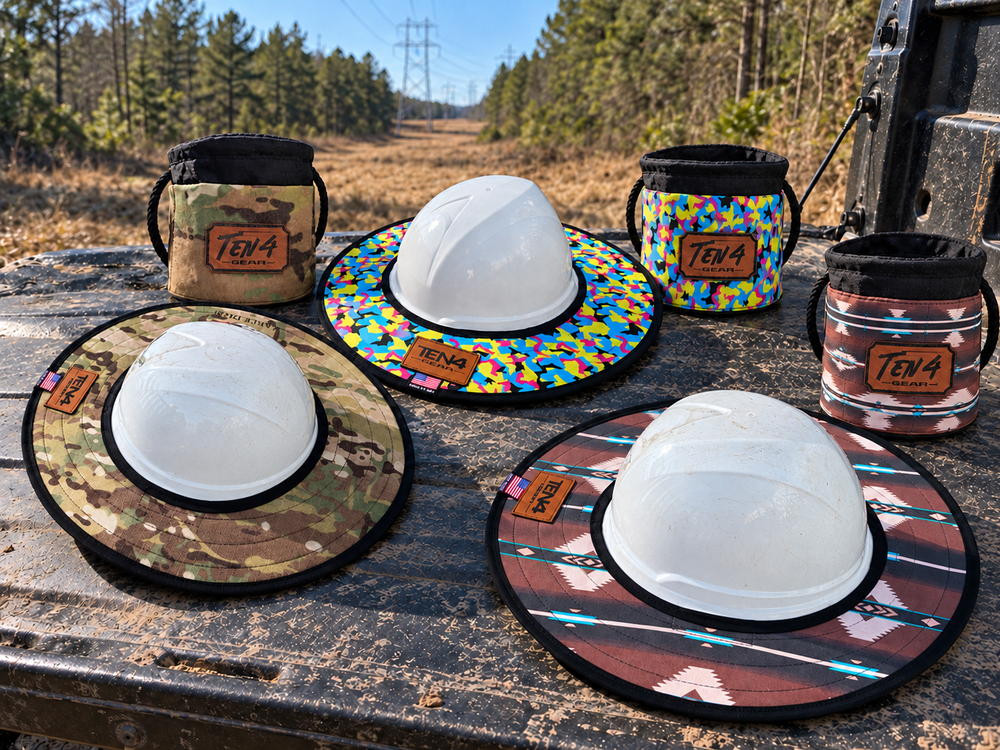 Three TEN4 sunshades and matching Grunt Sacks on a jobsite truck tailgate; plain white hard hats are display props and are not included.