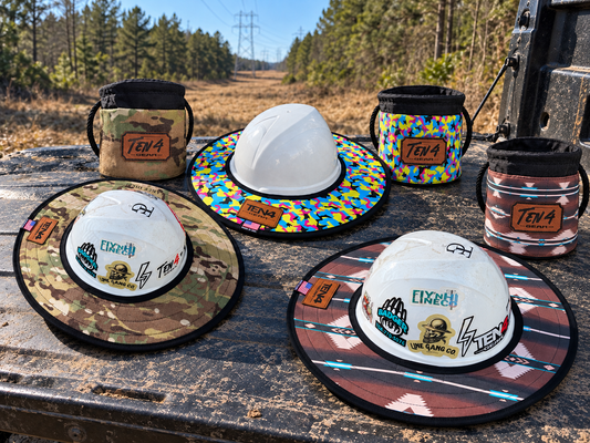 Three TEN4 sunshades and matching Grunt Sacks in Defender, Pop Rocks and southwest patterns on an outdoor truck tailgate; hard hats are display props
