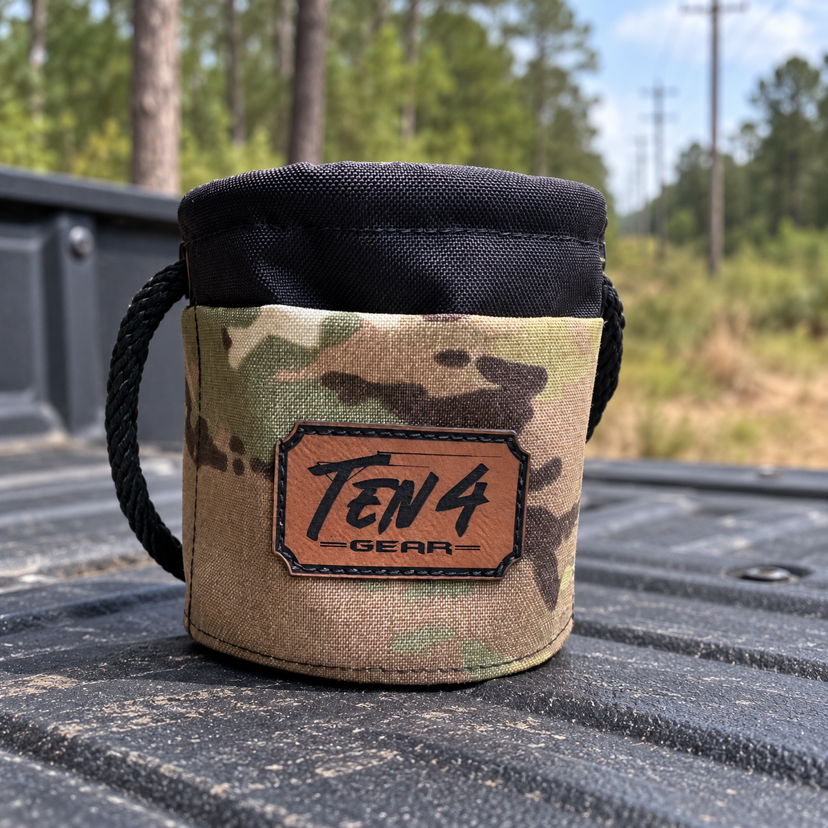 Defender camo Grunt Sack on a pickup tailgate at a wooded utility right of way