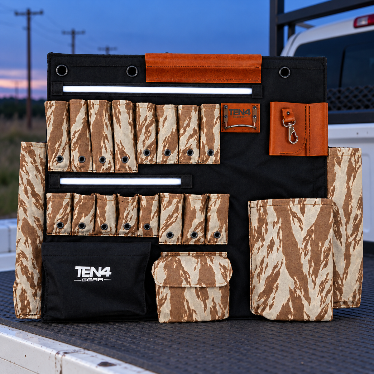Desert Tiger Stripe 32-inch TEN4 G Board with white LED glow at an outdoor utility worksite