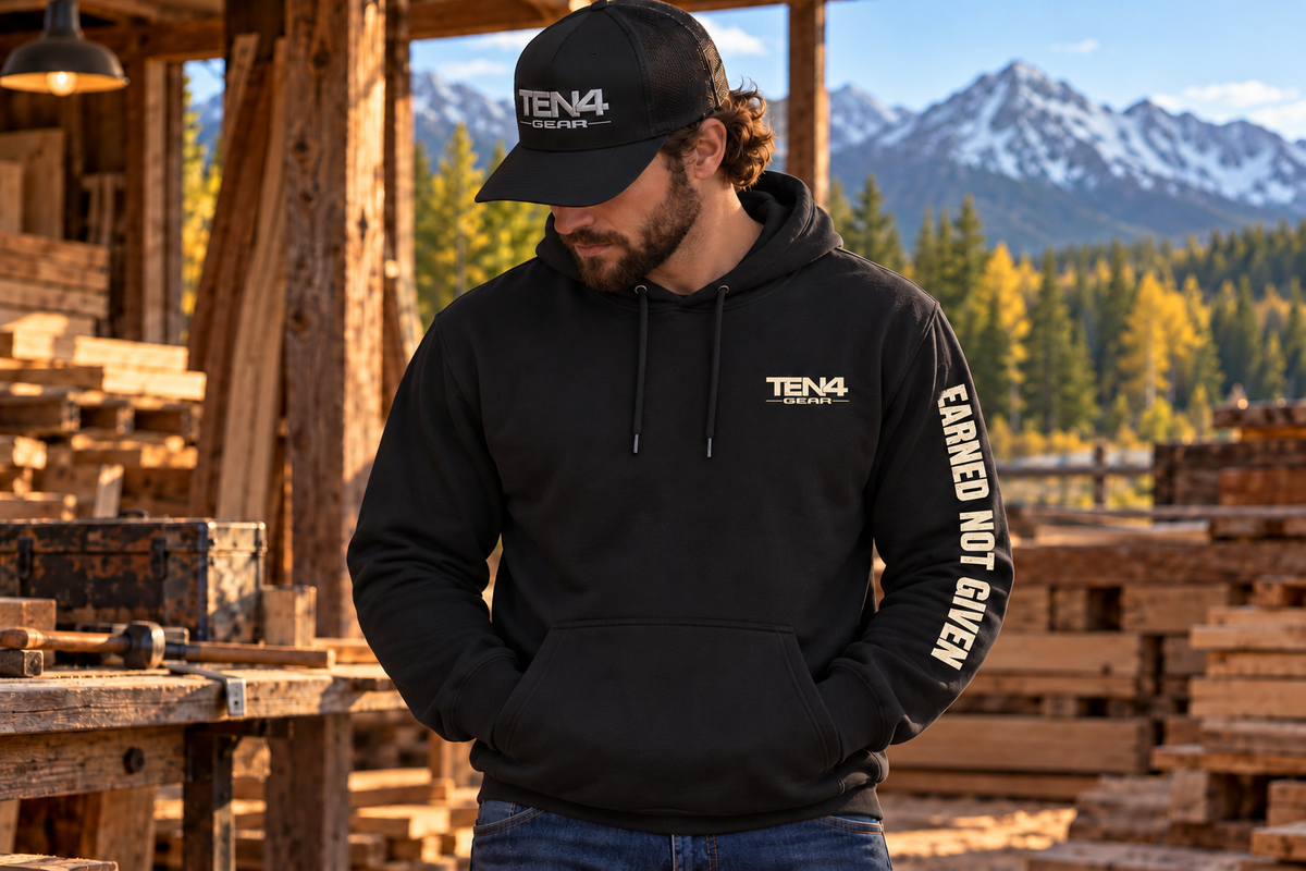 TEN4 Earned Not Given black hoodie with cream left chest logo and weathered left sleeve lettering