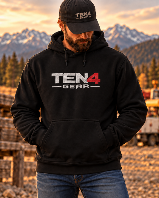 Black TEN4 Everyday Logo Hoodie with silver and red logo on bearded model in mountain scenery