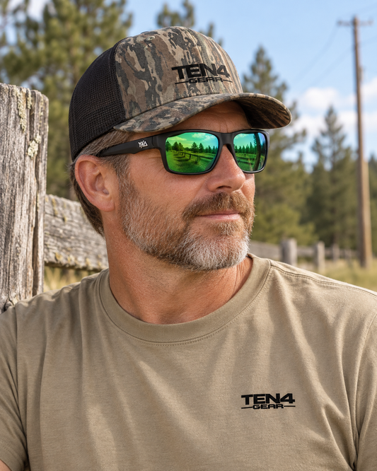 Lifestyle model mockup wearing Z87+ FullViz Green Revo and TEN4 apparel outdoors.