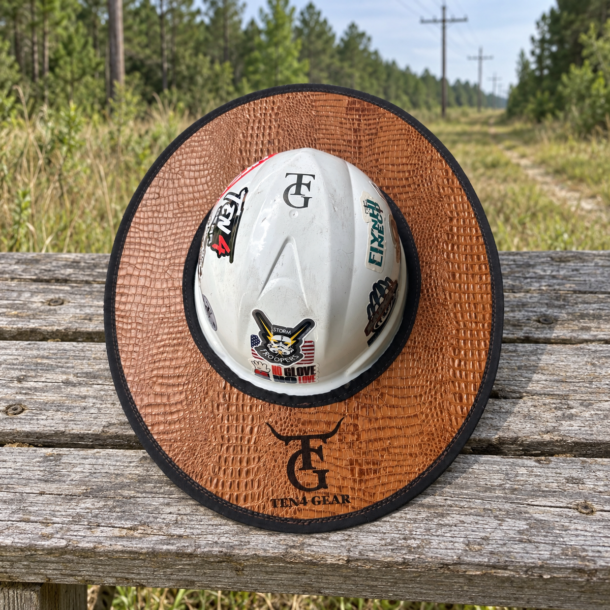 Cognac gator sunshade on an outdoor bench beside a powerline right-of-way