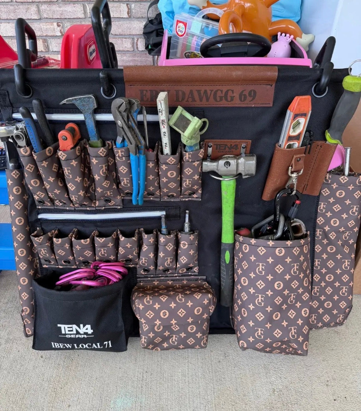Original photo of a larger TG Brown TEN4 G-Board fully loaded with tools, with personalized leather name panel, IBEW Local 71 pouch and both LED strips unlit. Tools and mounting hooks not included.