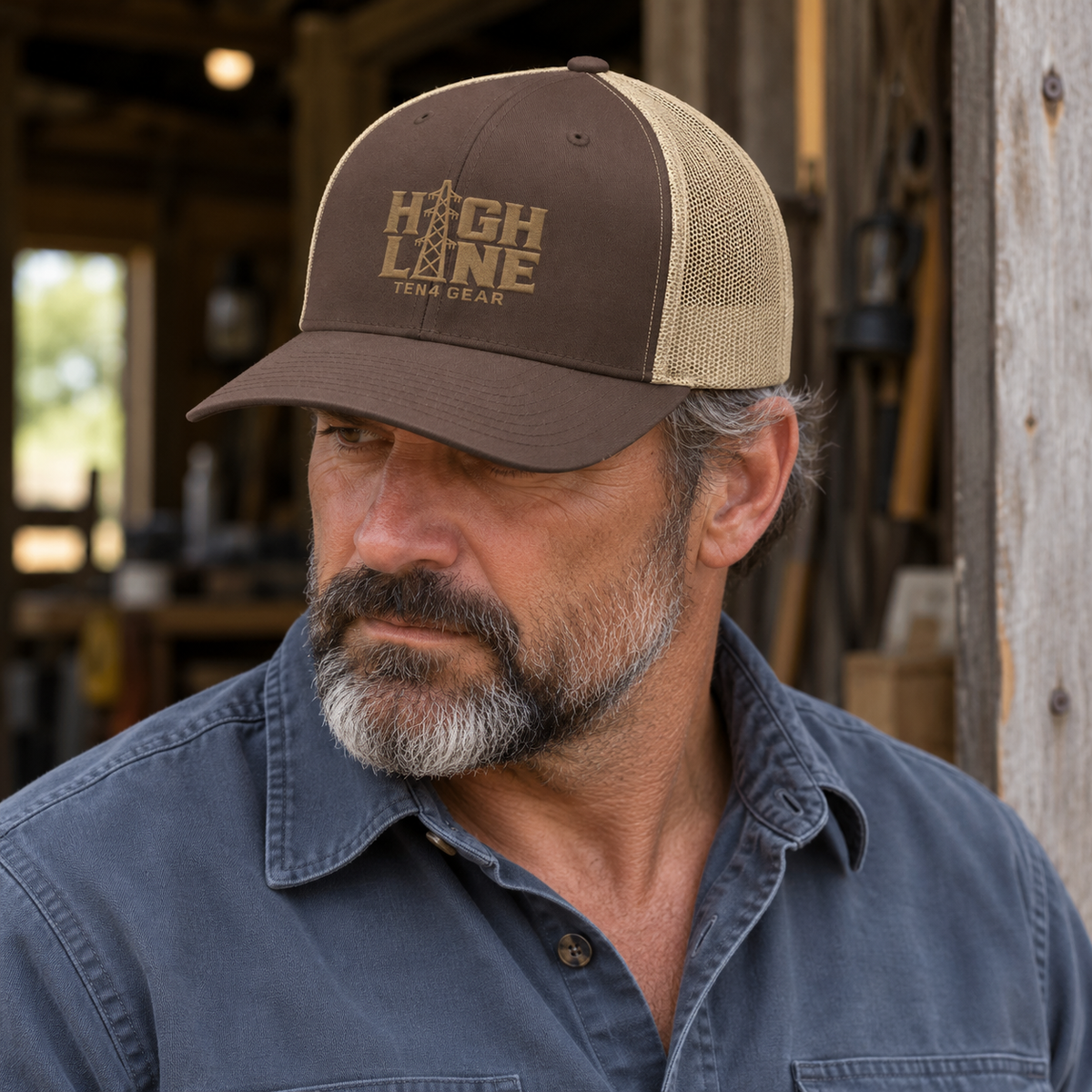 Brown khaki TEN4 HIGH LINE trucker hat with warm tan embroidery on a workshop model
