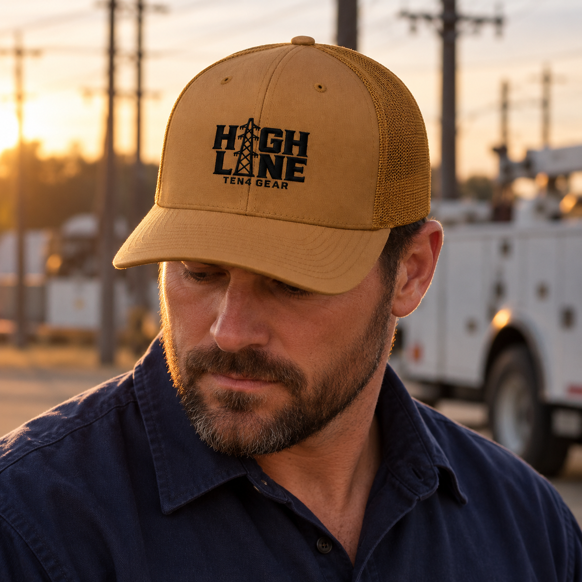 Caramel TEN4 HIGH LINE trucker hat with black embroidery on a lineman model