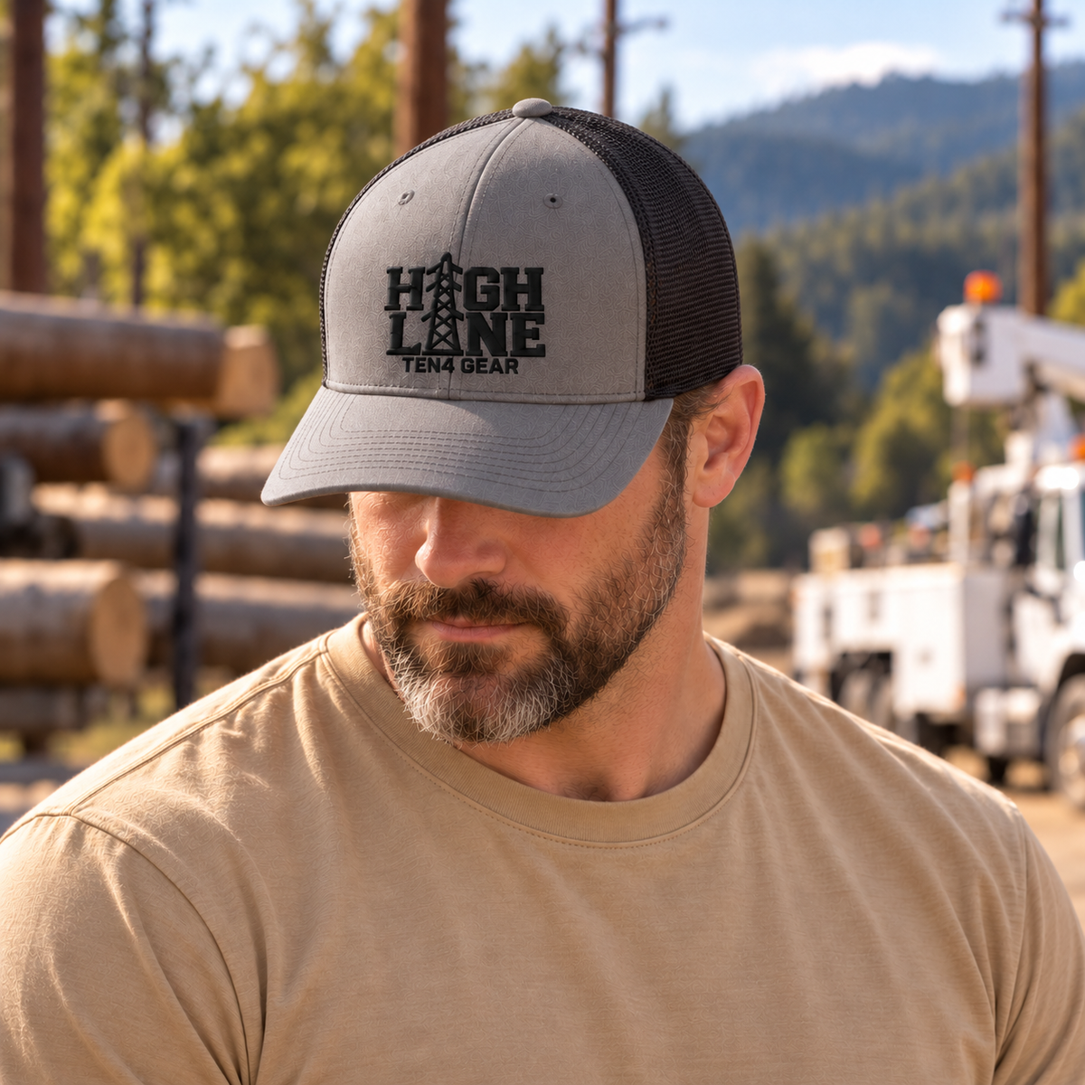 TEN4 HIGH LINE charcoal and black trucker hat — rugged model with head down