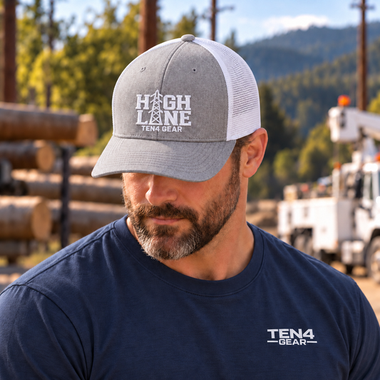 TEN4 HIGH LINE heather gray and white hat with white embroidery — head-down model in navy TEN4 Gear shirt