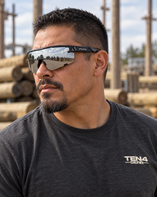 Lifestyle model mockup wearing Z87+ HiViz 2.0 Black Mirror and TEN4 apparel outdoors.