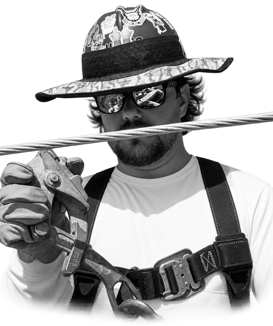 Lineman wearing a patterned sunshade, black-and-white portrait with background removed
