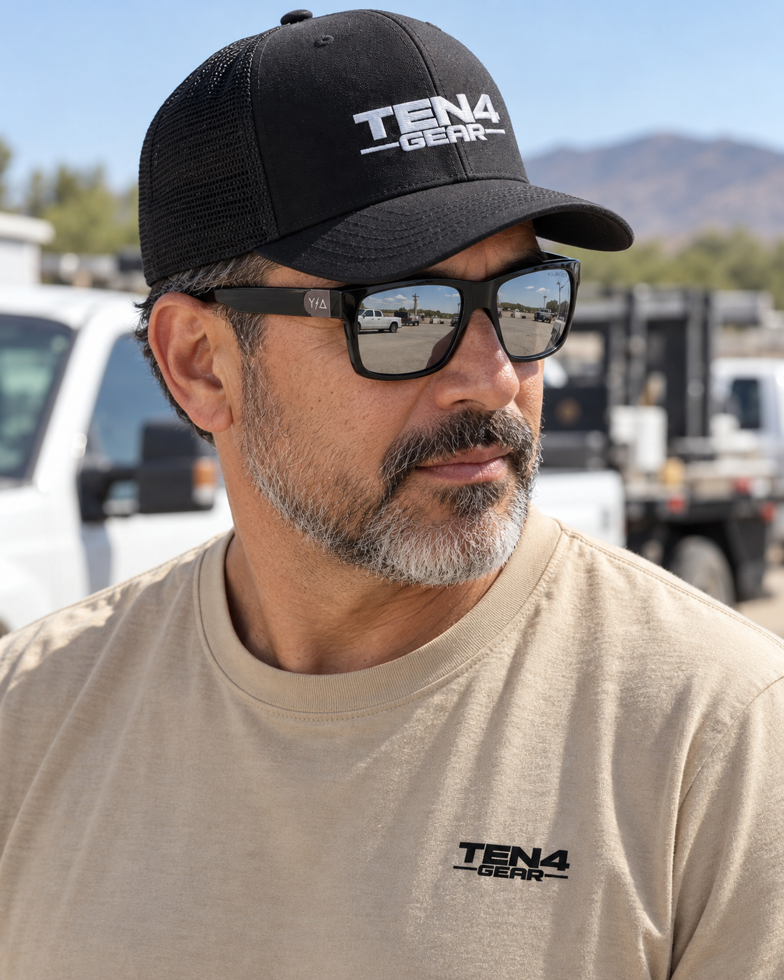 Lifestyle model mockup wearing Z87 MADHOOK2.0 LR: MIRROR POLARIZED and TEN4 apparel outdoors.