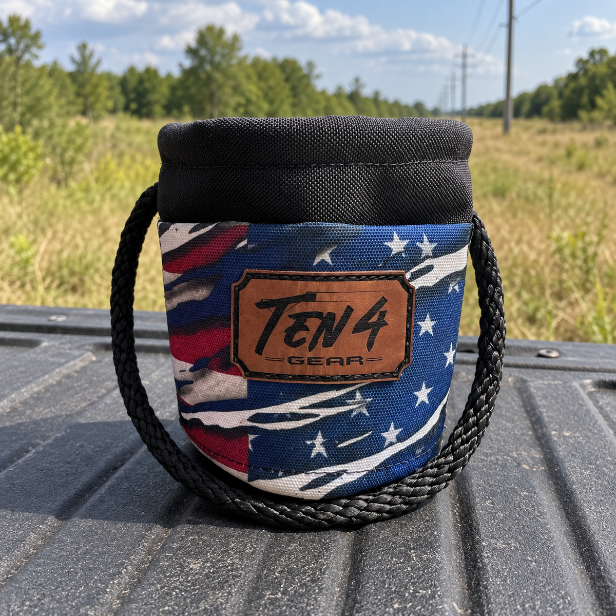 Patriot Grunt Sack with legacy TEN4 patch on a pickup tailgate at a rural utility worksite