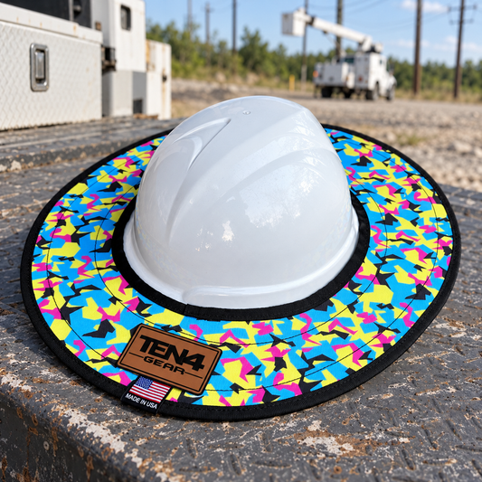 Pop Rocks hard hat sunshade with current rear TEN4 patch on a utility truck at an outdoor linework site
