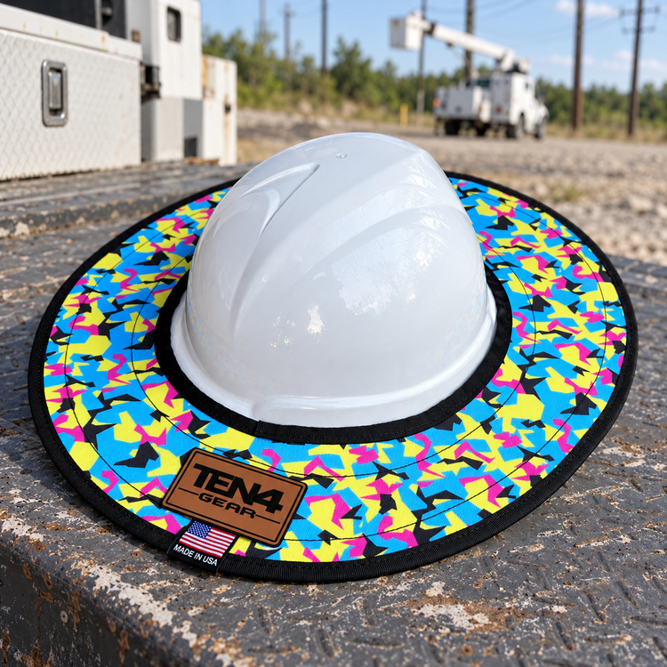 Pop Rocks hard hat sunshade with current rear TEN4 patch on a utility truck at an outdoor linework site