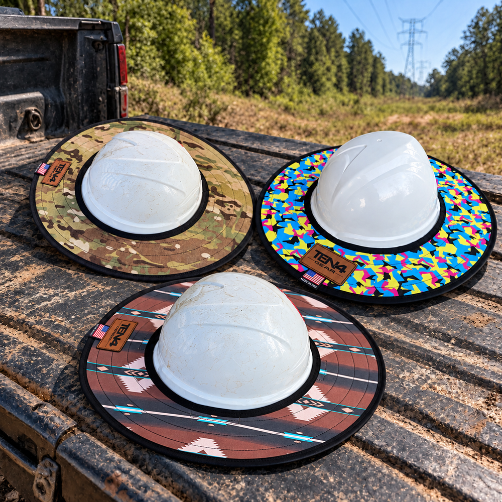 Three TEN4 sunshades on a jobsite truck tailgate with plain white hard hats used as display props; hard hats are not included.