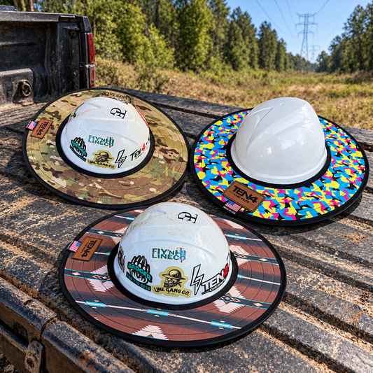 Three TEN4 sunshades in Defender, Pop Rocks and southwest patterns on an outdoor pickup tailgate; hard hats are display props