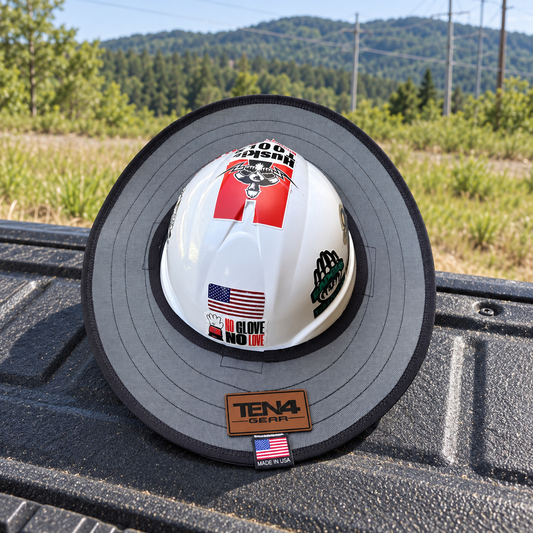 Solid Grey sunshade on a pickup tailgate beside a powerline right-of-way