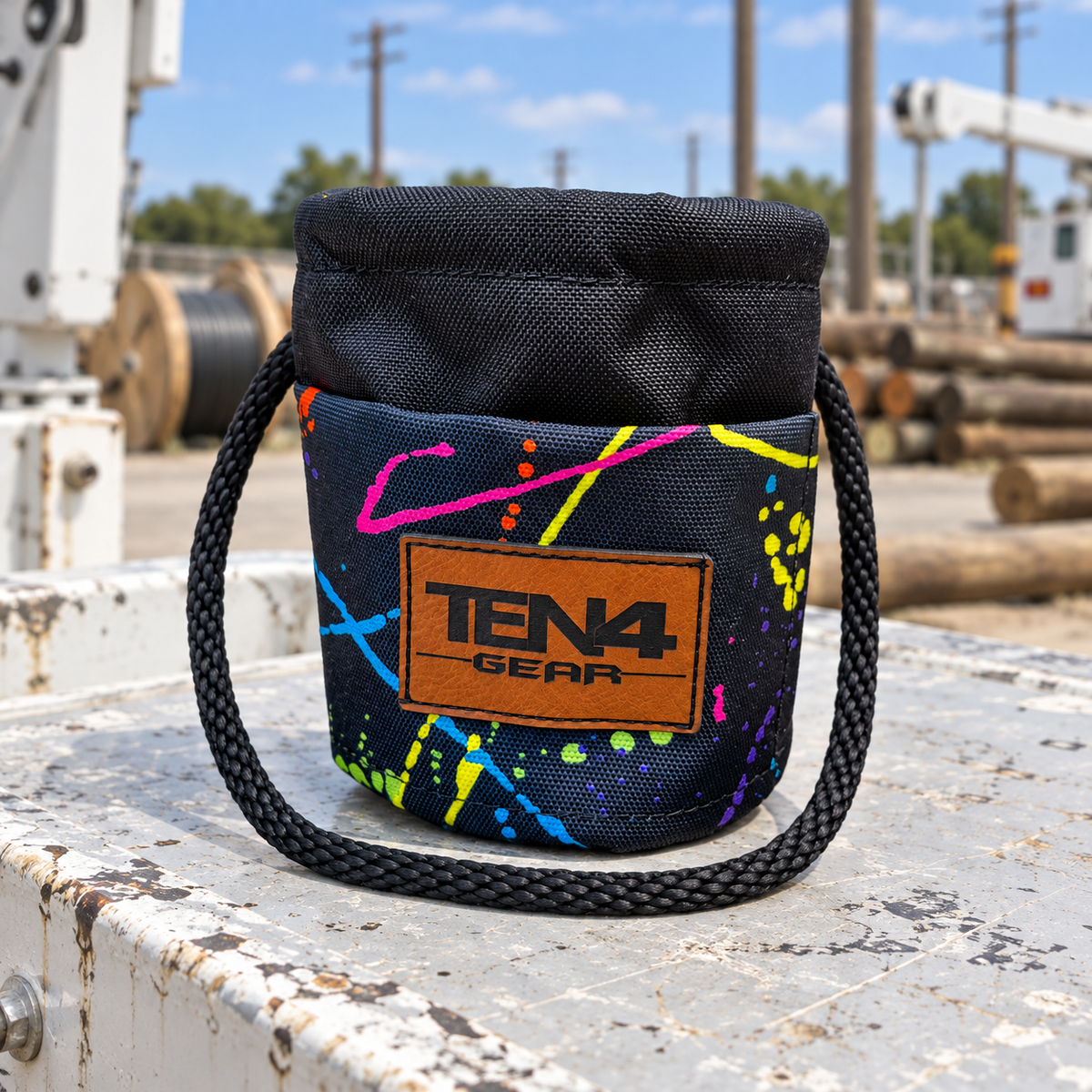 Splatter Grunt Sack with current TEN4 patch on a utility truck at an outdoor linework site