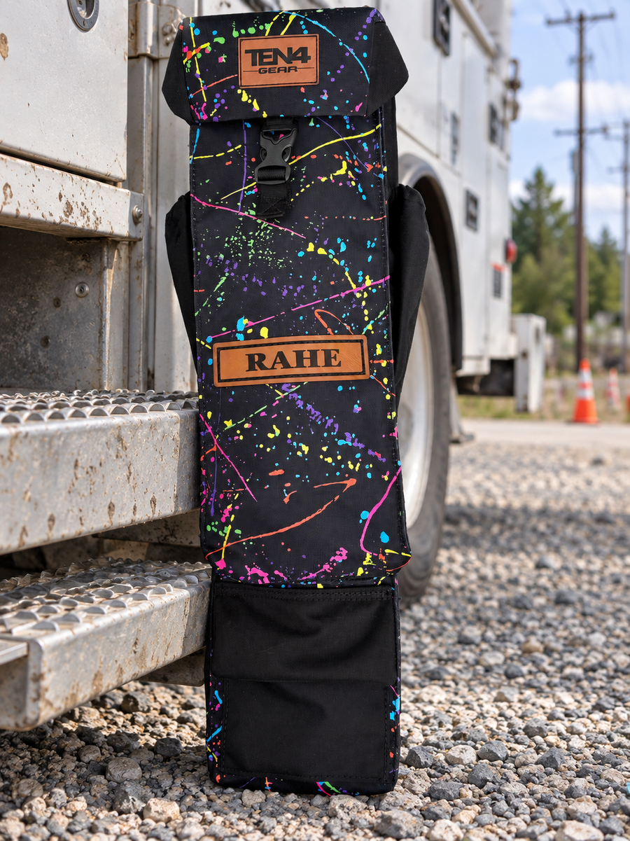 Splatter 29-inch Utility bag with formed buckle lid, side pockets and extra bottom pocket — original product photo; background edited to an outdoor utility jobsite.