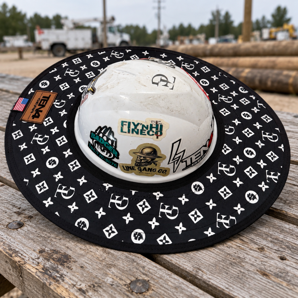 TG Black sunshade on a white hard hat resting on weathered wood at a utility crew yard