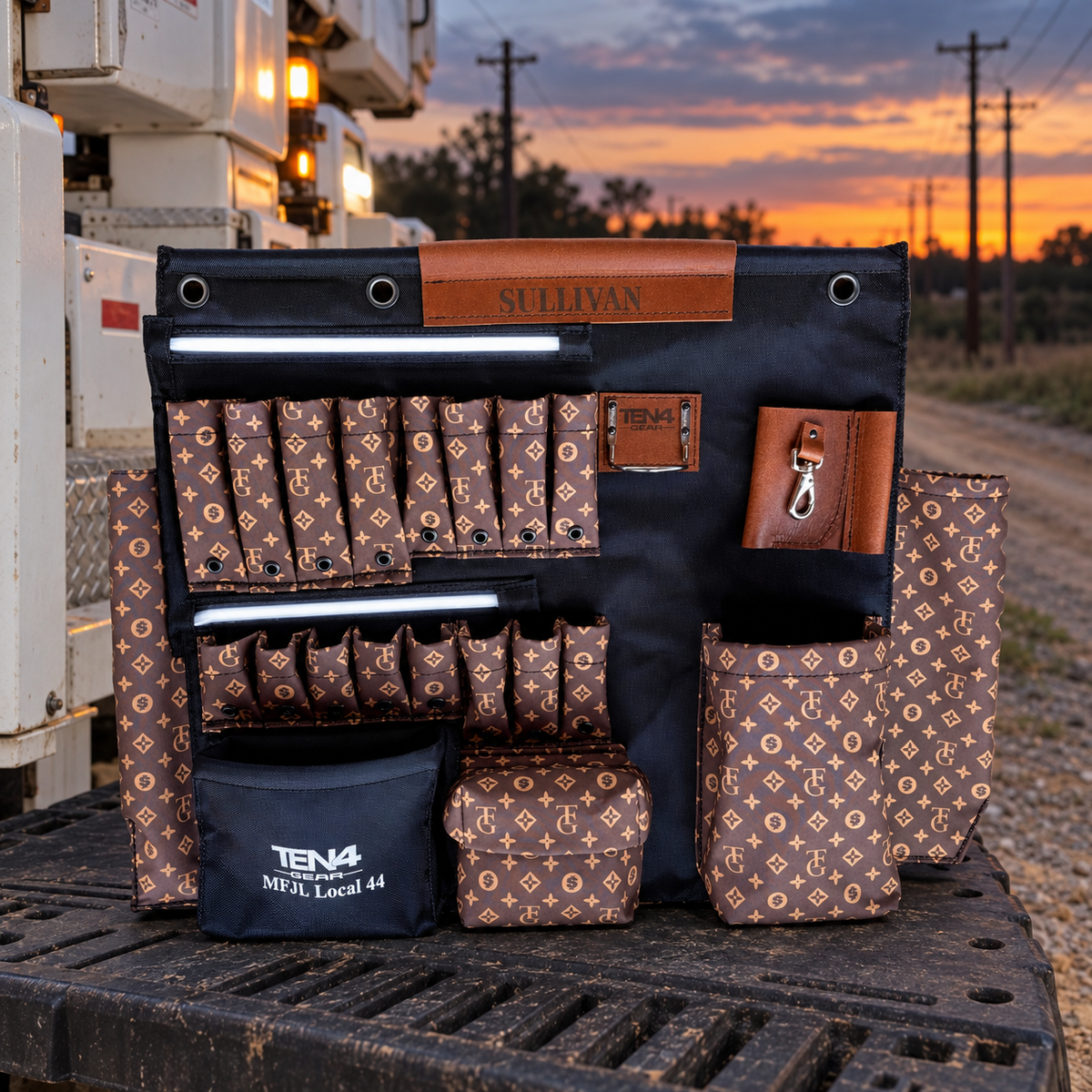 TG Brown 32-inch TEN4 G Board with white LED glow beside a utility truck at dusk
