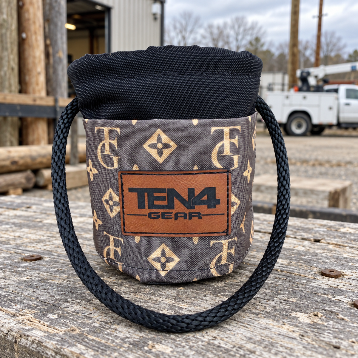 TG Brown Grunt Sack on a rustic workbench outside a utility workshop
