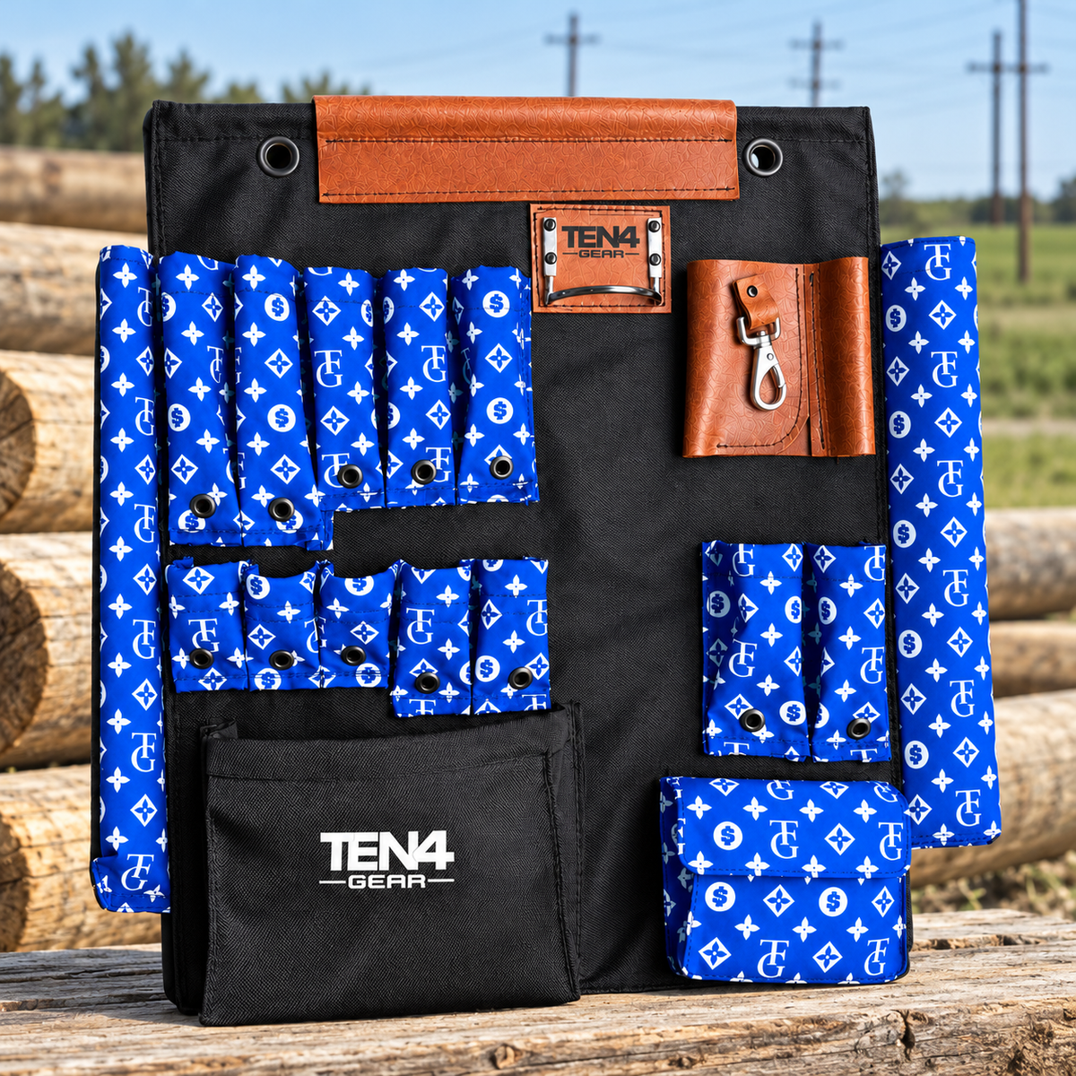 TG Royal 24-inch TEN4 Tool Board beside wooden utility poles at a line construction worksite