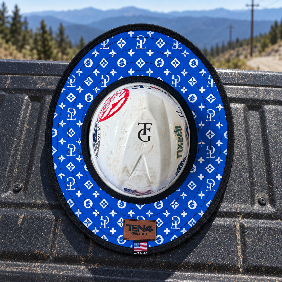 TG Royal sunshade on a pickup tailgate with mountain and powerline scenery