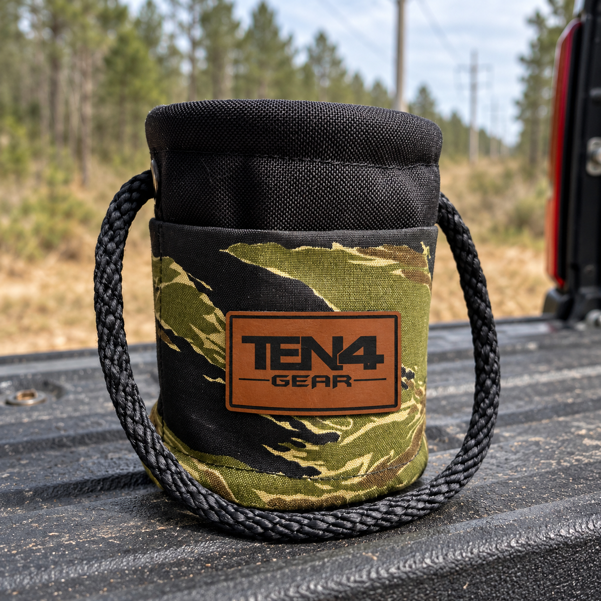 Tiger Stripe Grunt Sack with current TEN4 patch on a pickup tailgate