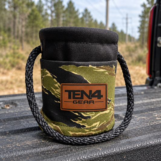 Tiger Stripe Grunt Sack with current TEN4 patch on a pickup tailgate