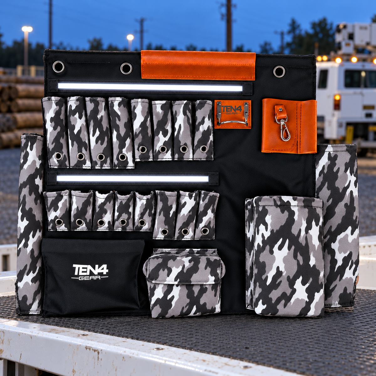Urban Camo 32-inch TEN4 G Board with white LED glow at an outdoor utility worksite